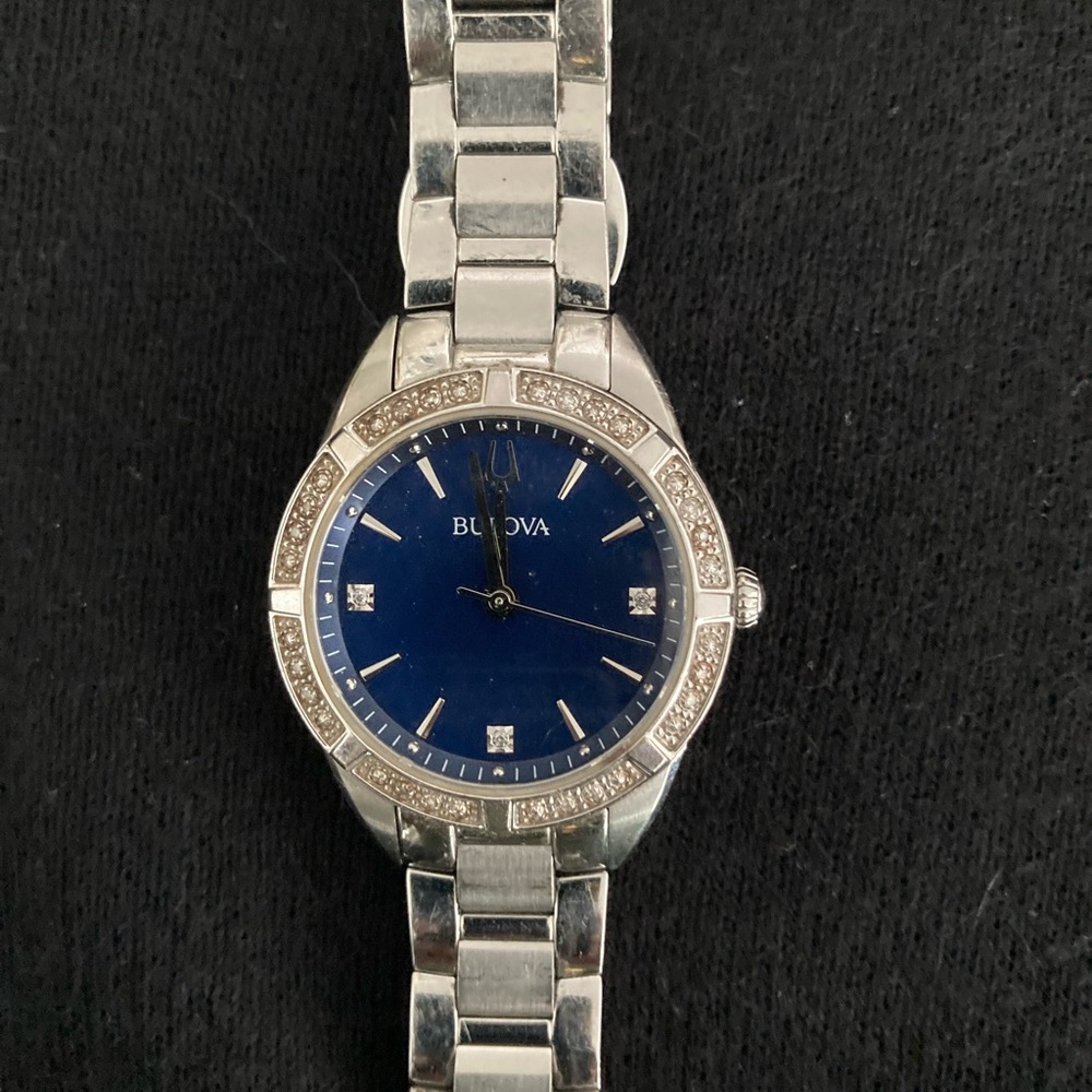 Beautiful watch with pave diamond detail and sapphire blue face. Perf condition